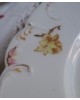Assiettes porcelaine Haviland. Motif fleuri. Peinture dorée sur le bord.